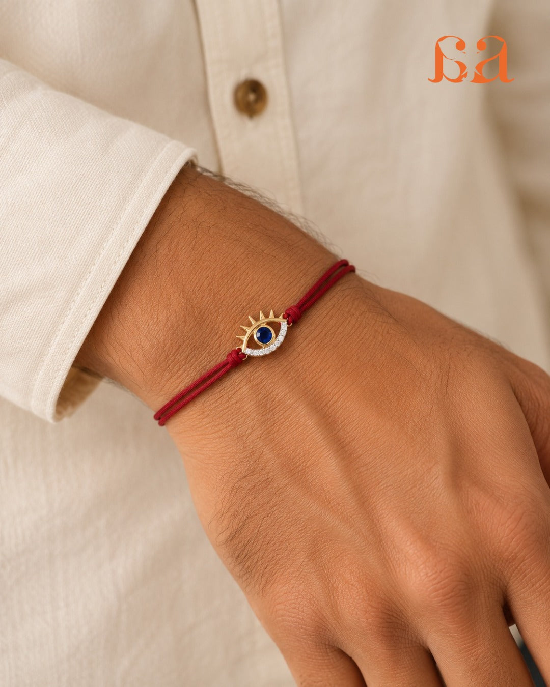 Man wearing Evil Eye 9KT Gold Rakhi on wrist