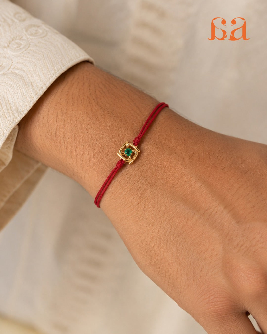 Man wearing Fortune 9KT Gold Rakhi on wrist