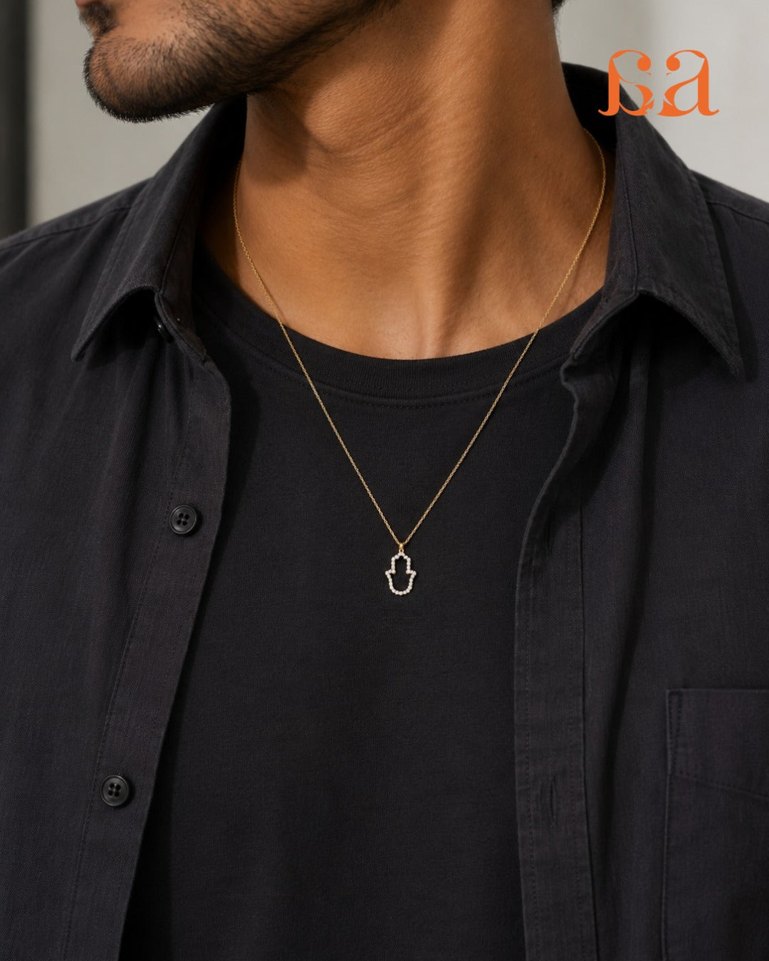 Man wearing Hamsa 9KT Gold Rakhi pendant on chain