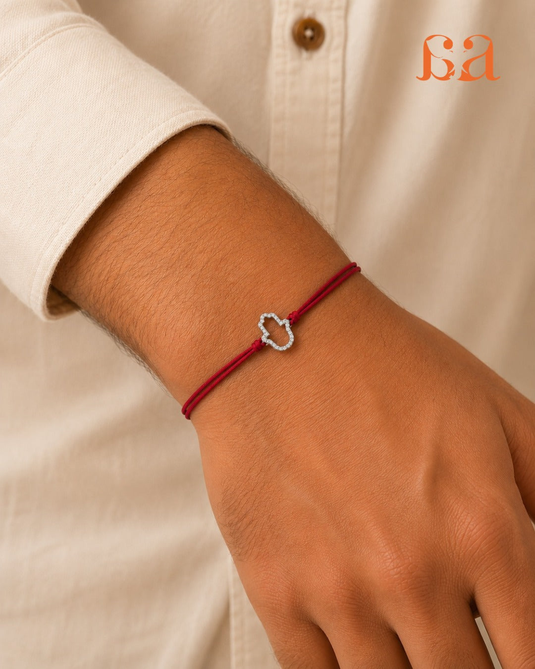Man wearing Hamsa 9KT Gold Rakhi on wrist