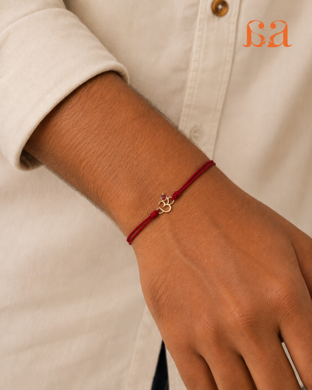 Man wearing Om 9KT Gold Rakhi on wrist